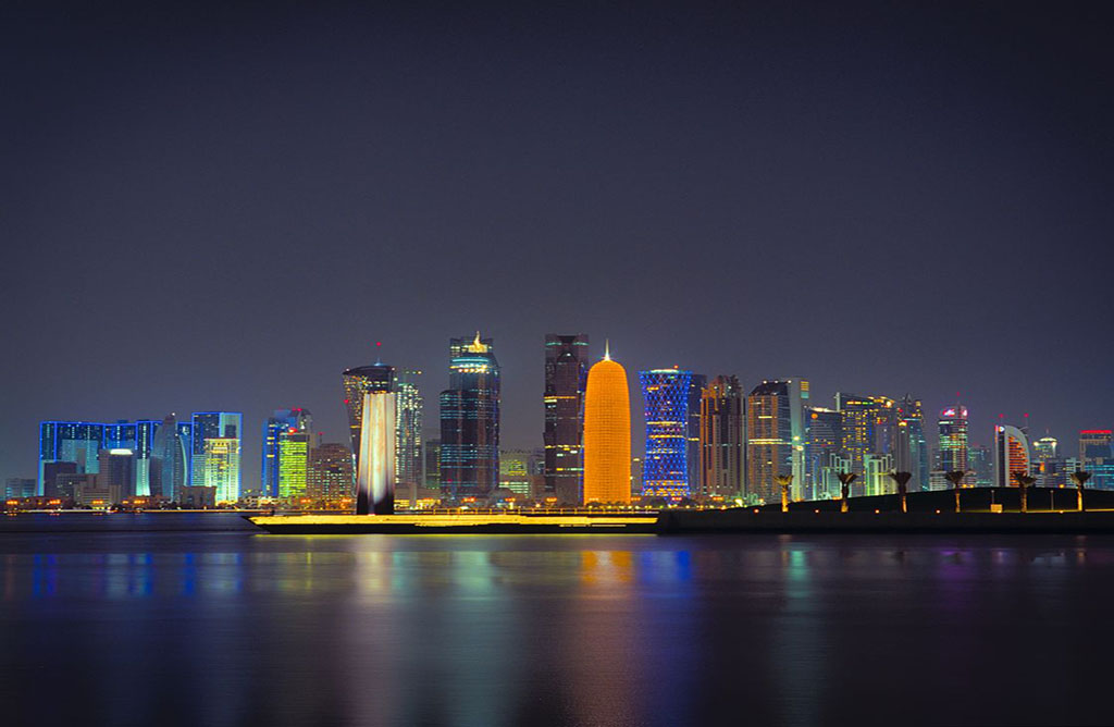 A nighttime view of the city of Doha, the largest city in Qatar. Photo by Sam Agnew.