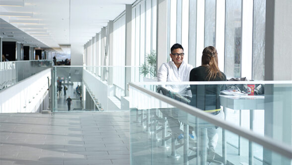 Students relax in a hallway at Laurentian University.