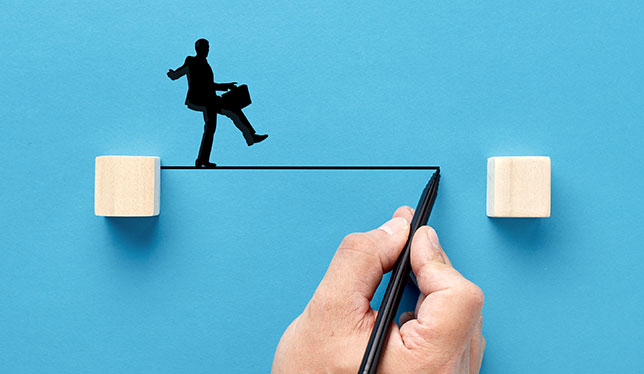 man balancing on a drawn line
