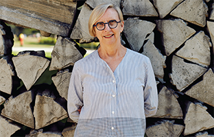 Barbara Cole stands in front of Wood picture 2