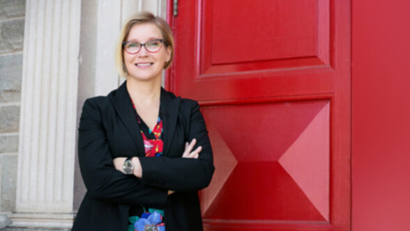 women infront of red door